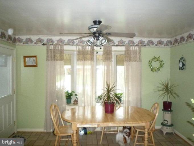 2013 Hopefield Road Silver Spring, MD 20905 - Photo 12 of 30 a view of a dining room with furniture and chandelier