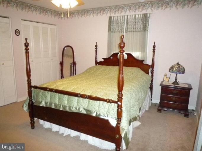 2013 Hopefield Road Silver Spring, MD 20905 - Photo 19 of 30 a bed sitting in a room next to a window