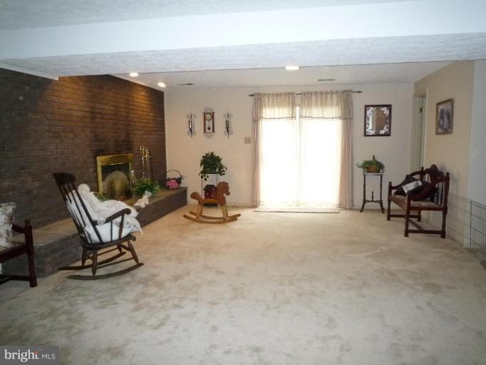 2013 Hopefield Road Silver Spring, MD 20905 - Photo 27 of 30 a view of a livingroom with lounge chair and a window