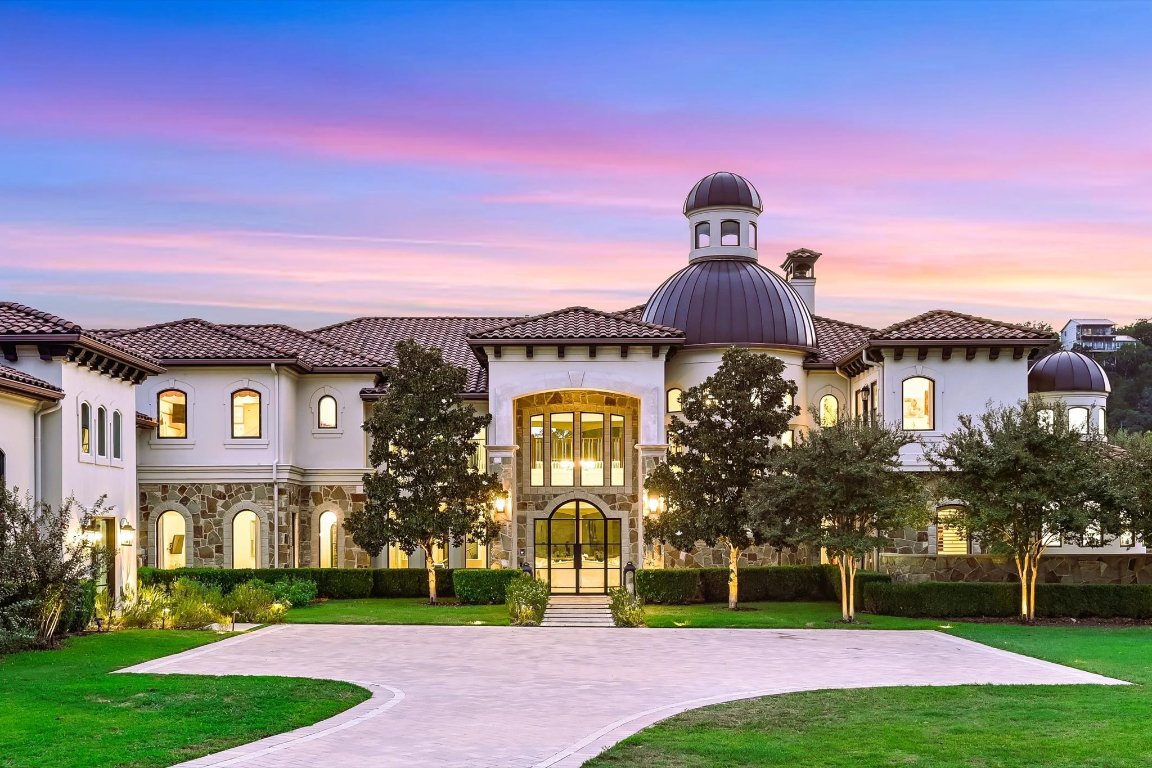 14132 Flat Top Ranch Road Austin, TX 78732 - Photo 2 of 40 a front view of a house with a yard
