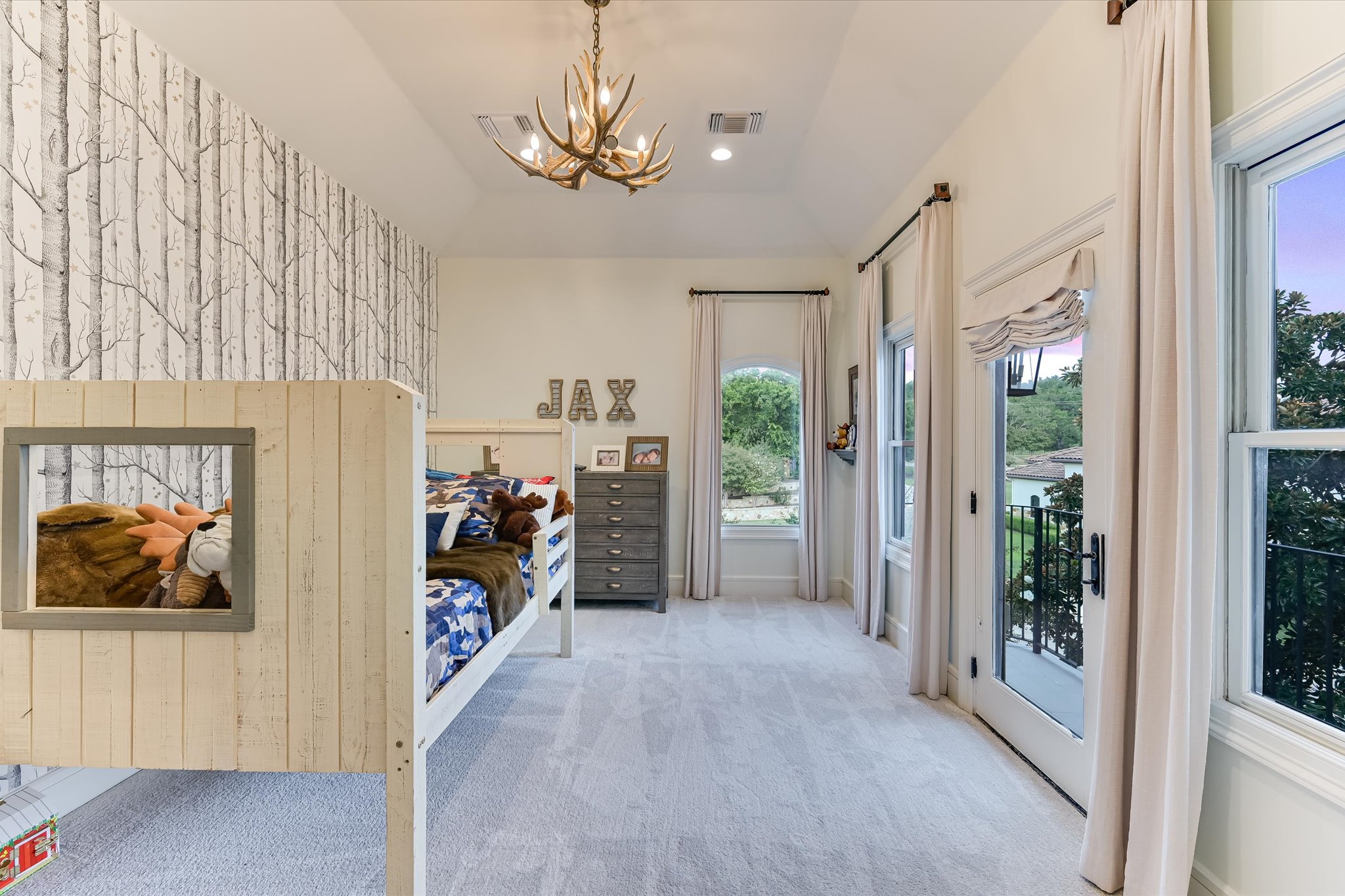 14132 Flat Top Ranch Road Austin, TX 78732 - Photo 27 of 40 a view of a hallway with a livingroom with furniture and a window