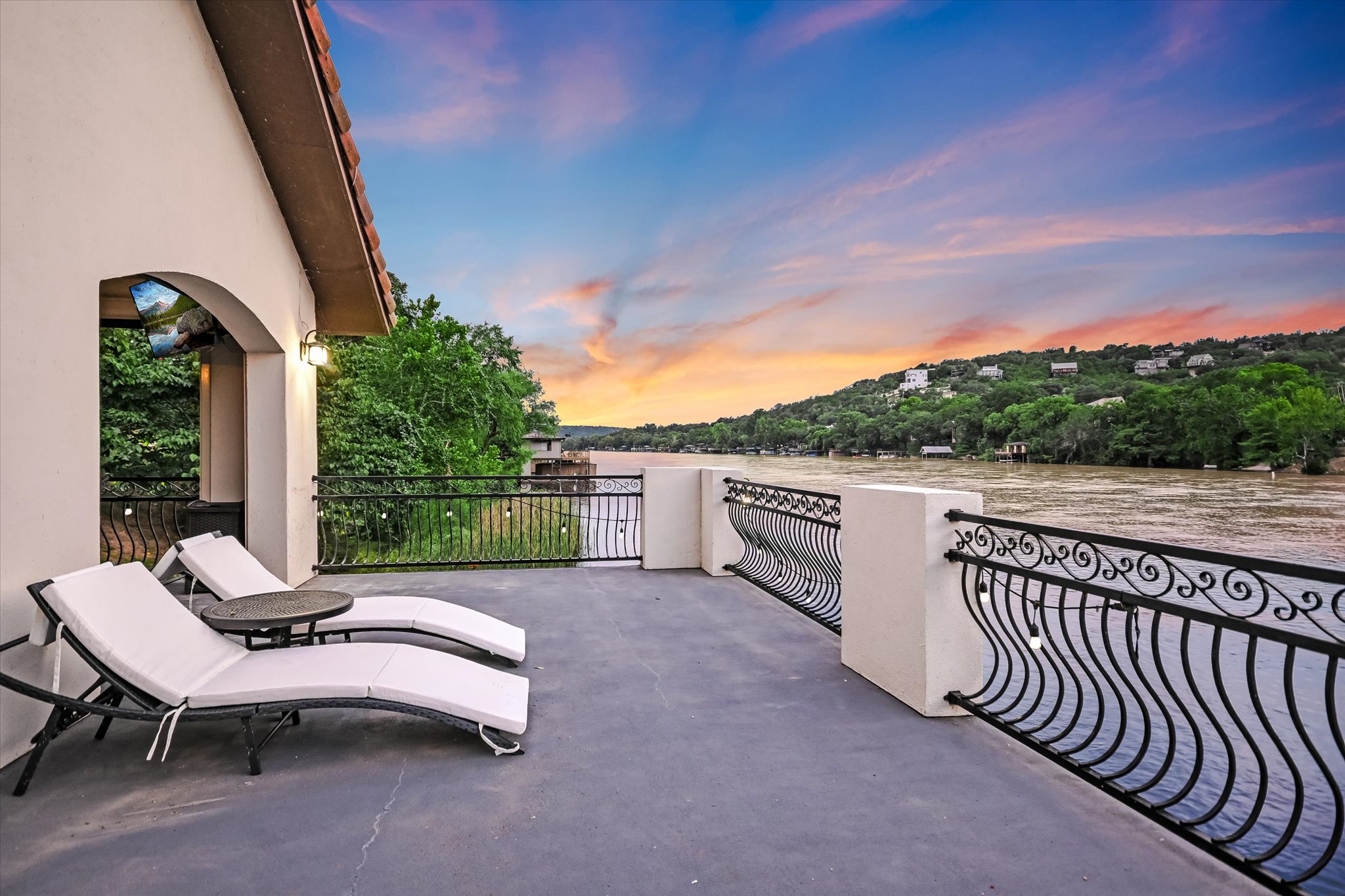 14132 Flat Top Ranch Road Austin, TX 78732 - Photo 3 of 40 a view of a patio with a table and chairs