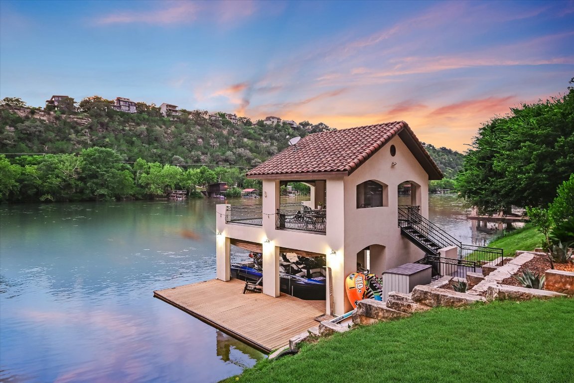 14132 Flat Top Ranch Road Austin, TX 78732 - Photo 35 of 40 a view of house with garden and a pond