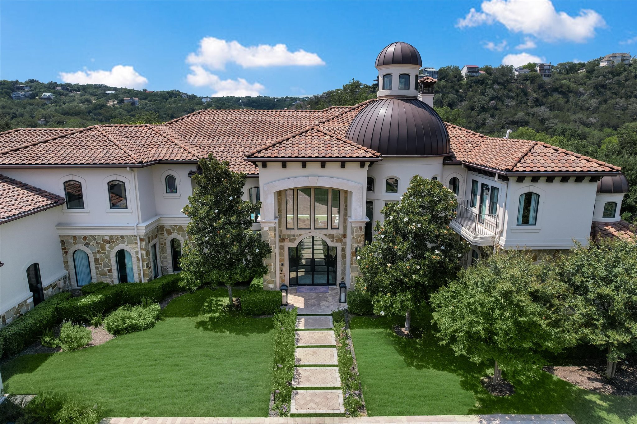 14132 Flat Top Ranch Road Austin, TX 78732 - Photo 37 of 40 a front view of a house with a yard and garage