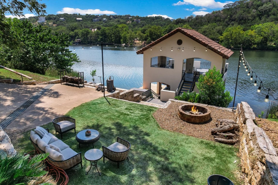 14132 Flat Top Ranch Road Austin, TX 78732 - Photo 38 of 40 a view of a backyard with furniture and a garden