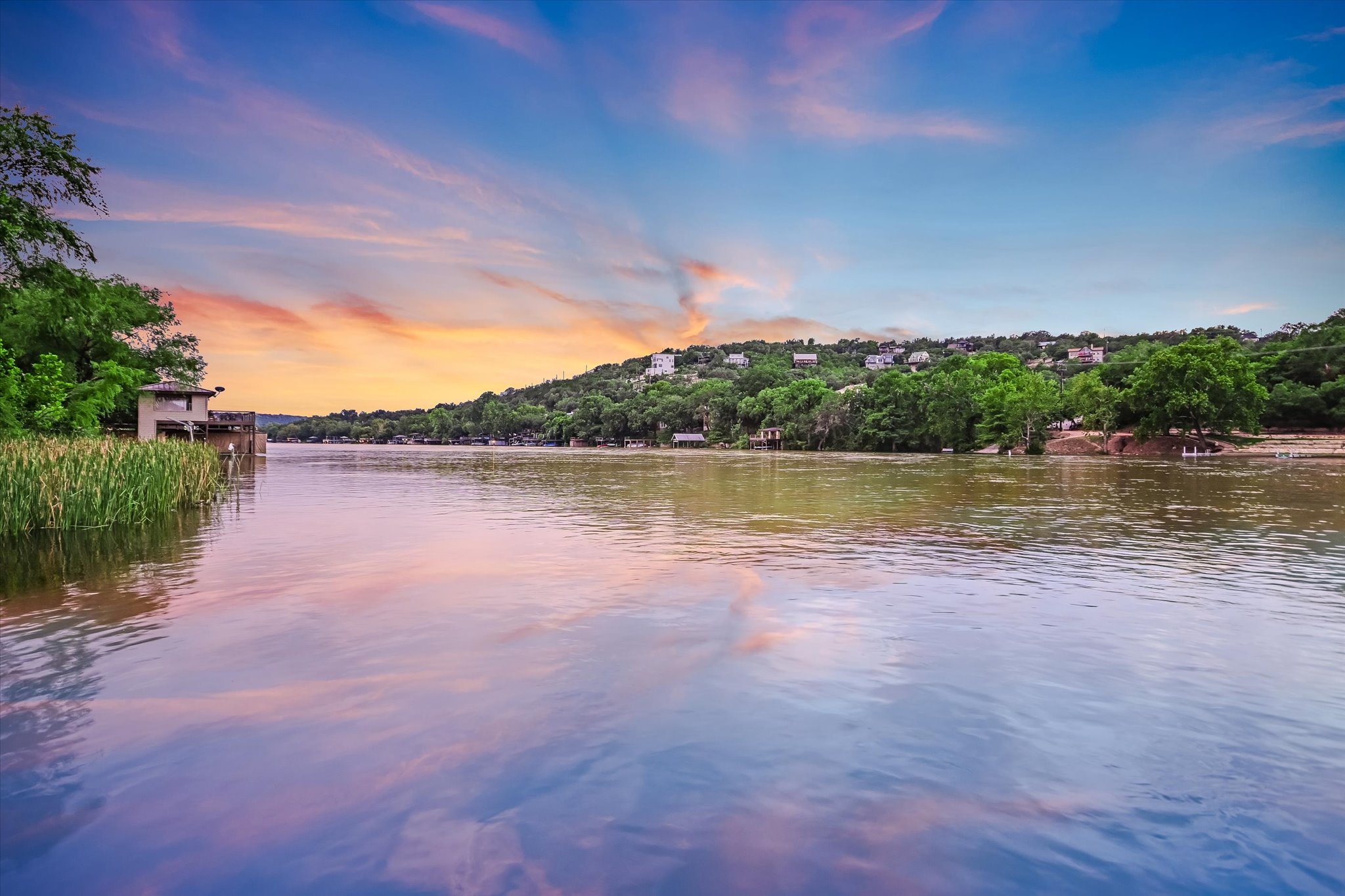 14132 Flat Top Ranch Road Austin, TX 78732 - Photo 6 of 40 a view of a lake with houses in the back