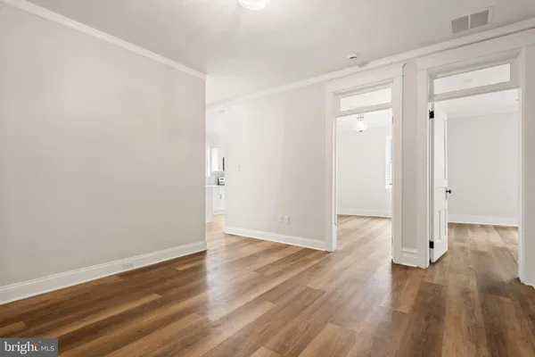a view of wooden floor in an empty room