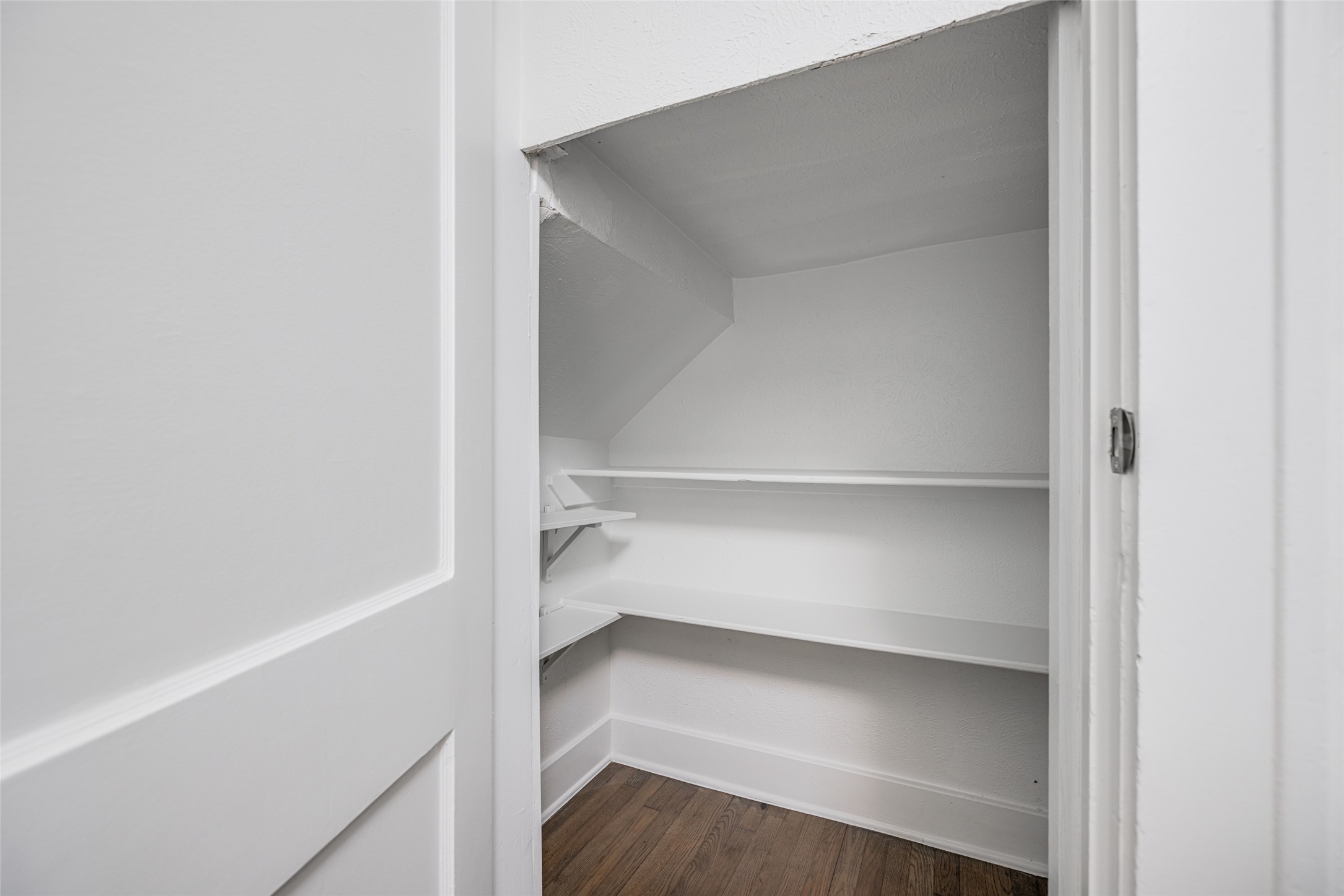 601 Bomar Street Houston, TX 77006 - Photo 19 of 28 a storage room with empty racks