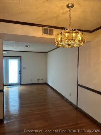 a view of a big room with wooden floor