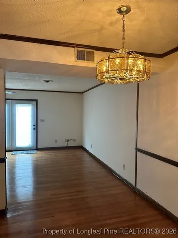 a view of a big room with wooden floor