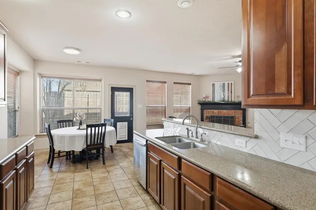 a kitchen with granite countertop a sink and a granite counter tops
