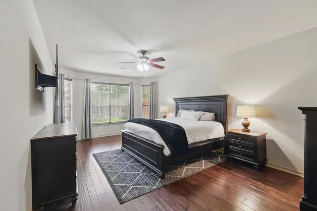 a bathroom with a sink vanity mirror and toilet