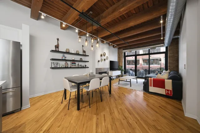 a view of a dining room with furniture window and wooden floor