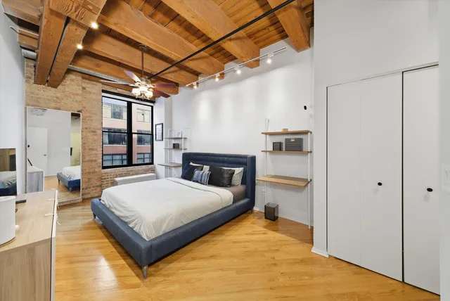 a bedroom with a bed and a view of bathroom