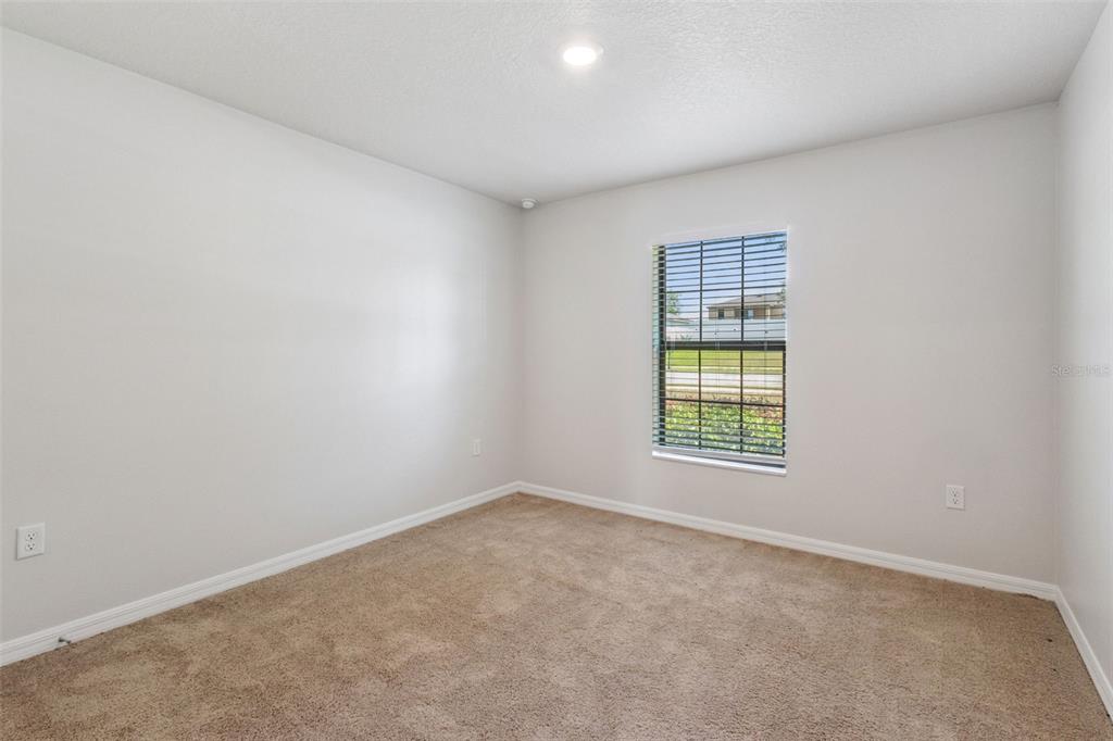 1613 Orne Street Mascotte, FL 34753 - Photo 10 of 31 an empty room with a window