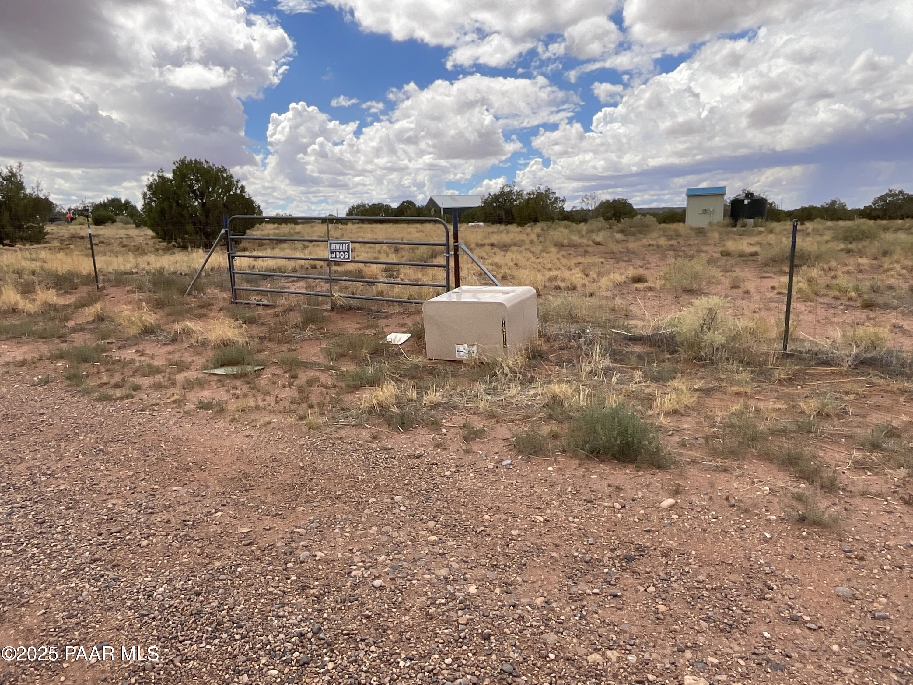 Lot 4 Ranch Of The White Mountains Snowflake, AZ 85937 - Photo 6 of 9 a backyard of a house with table and chairs