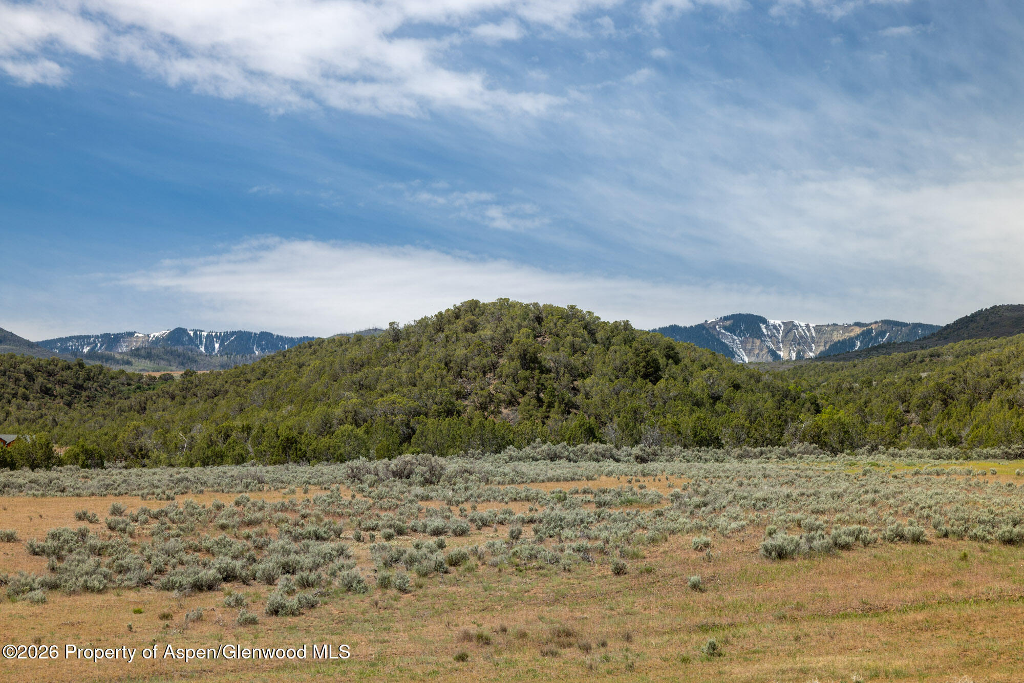 Tbd North Cedar Springs Ranch Road Rifle, CO 81650 - Photo 2 of 13 a view of a dry yard with mountains in the background