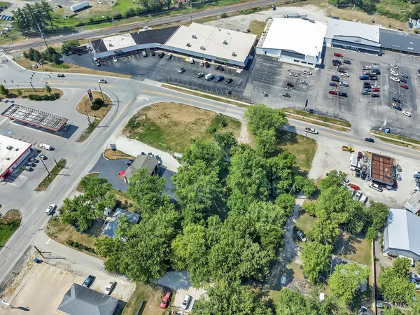 an aerial view of residential house with outdoor space and swimming pool