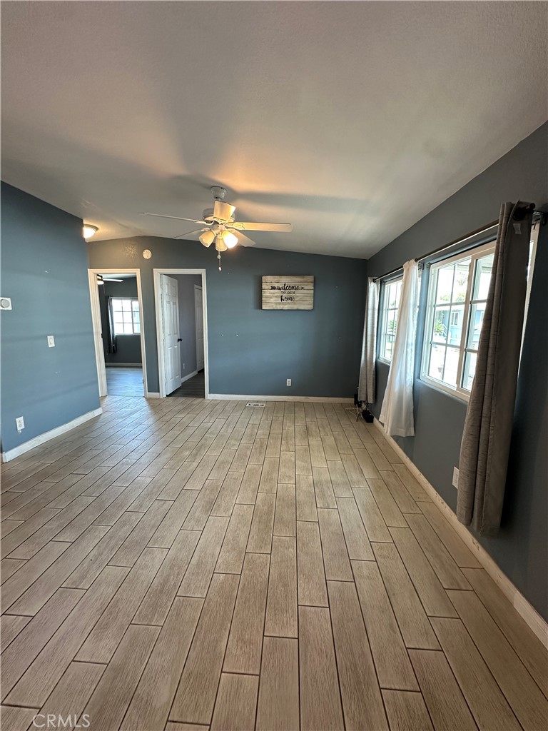 3825 Crestmore Road, Unit 414 Riverside, CA 92509 - Photo 7 of 31 a view of empty room with wooden floor and fan