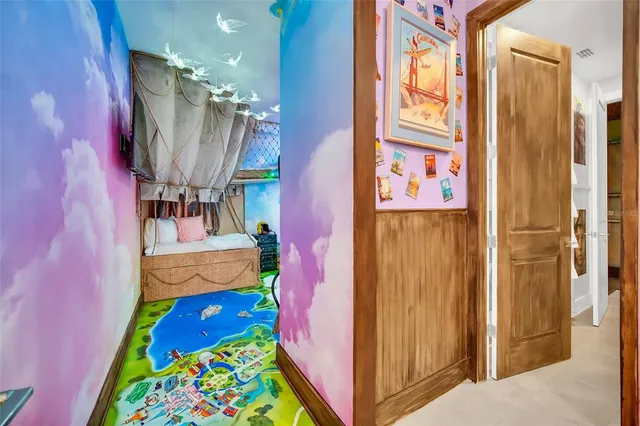 a kitchen with stainless steel appliances granite countertop a sink a stove and a wooden floors