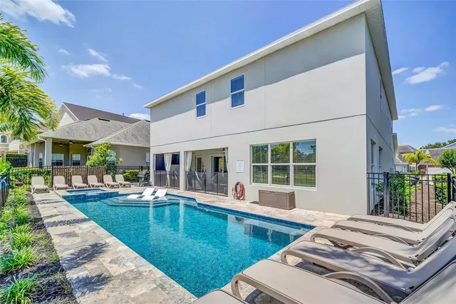 a living room with furniture and large window