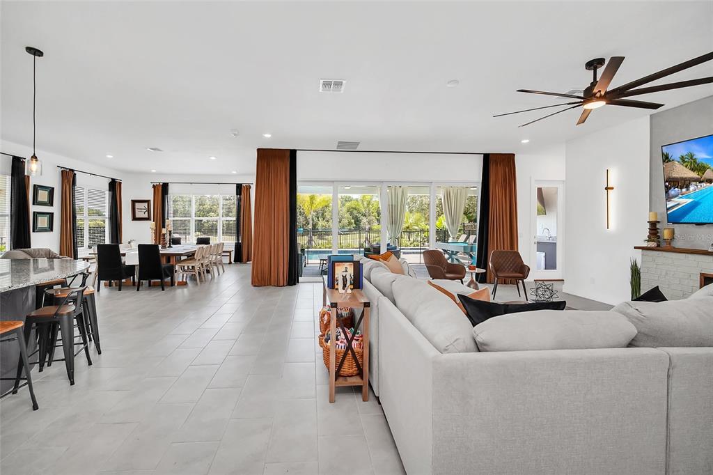 1213 Radiant Street Reunion, FL 34747 - Photo 24 of 84 a living room with furniture and a large window