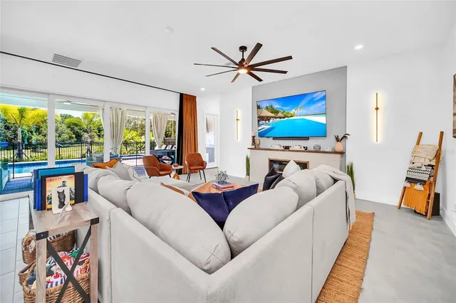 a bathroom with a granite countertop sink mirror vanity and toilet
