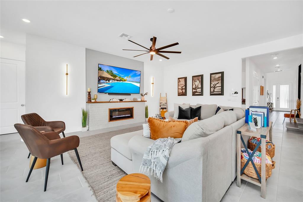 1213 Radiant Street Reunion, FL 34747 - Photo 31 of 84 a living room with furniture and a flat screen tv