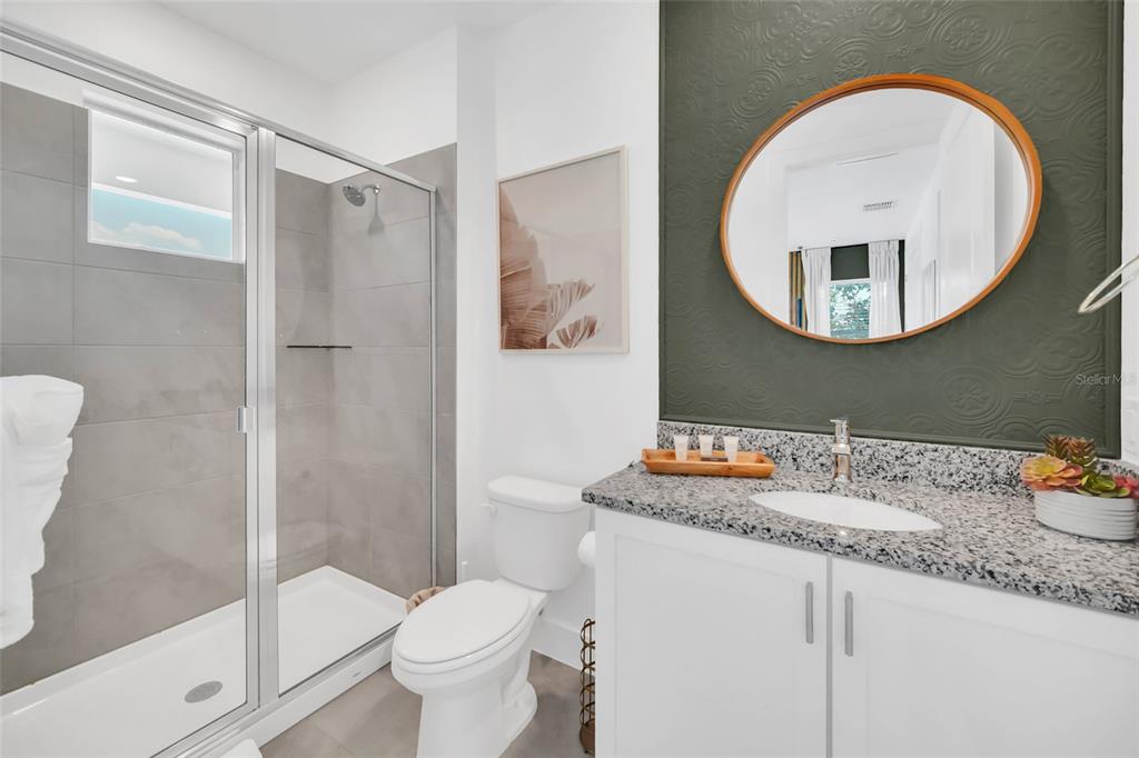 1213 Radiant Street Reunion, FL 34747 - Photo 47 of 84 a bathroom with a sink and a mirror