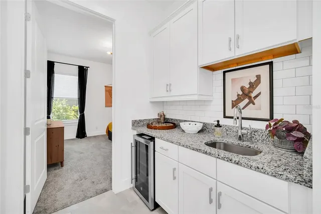 a view of a swimming pool with outdoor seating