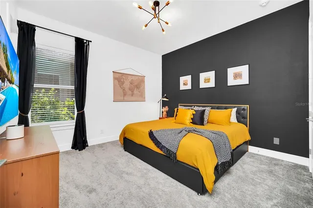 a view of a house with swimming pool and sitting area