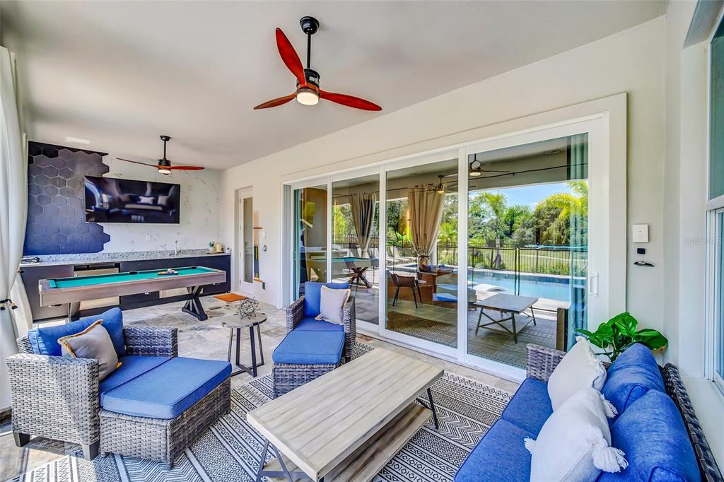 1213 Radiant Street Reunion, FL 34747 - Photo 74 of 84 a living room with furniture and a large window