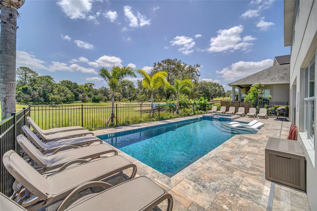 1213 Radiant Street Reunion, FL 34747 - Photo 76 of 84 a view of a swimming pool with a patio and a yard