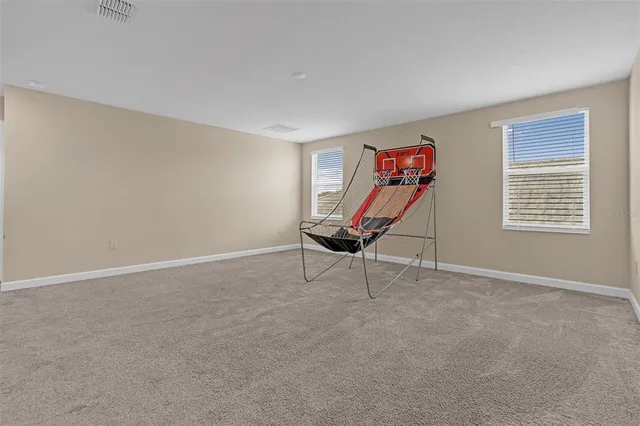 a view of a hallway with stairs