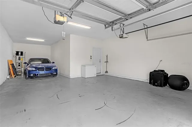 an aerial view of a house with a lake view