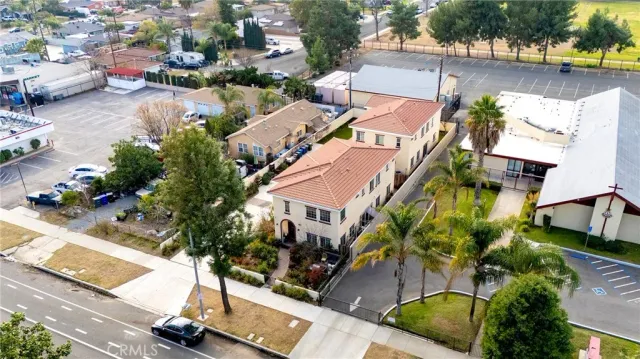 an aerial view of residential houses with outdoor space