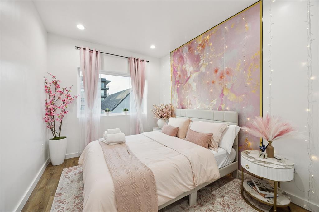 907 Bayonne Street Dallas, TX 75212 - Photo 17 of 38 a bedroom with a bed and a painting on the wall