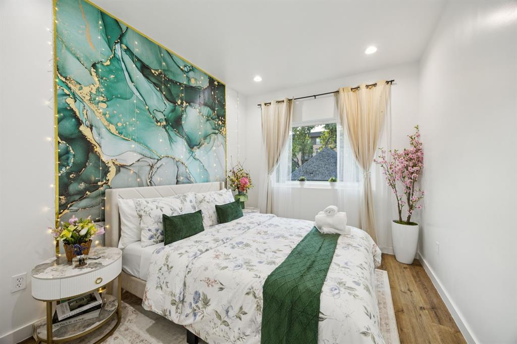 907 Bayonne Street Dallas, TX 75212 - Photo 18 of 38 a bedroom with a bed and a window