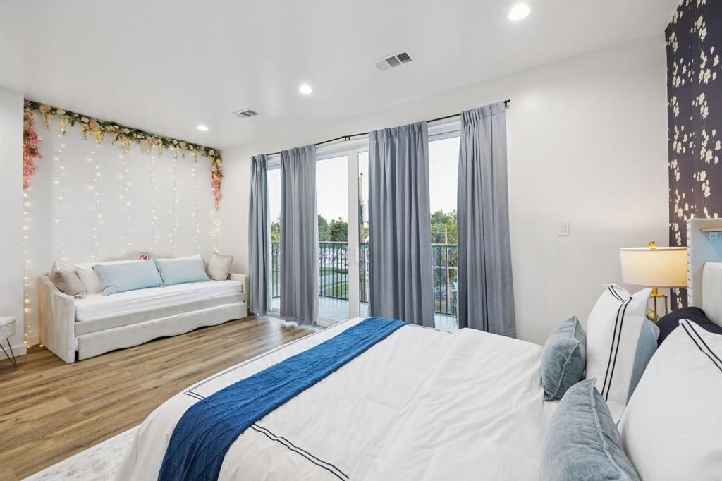 907 Bayonne Street Dallas, TX 75212 - Photo 21 of 38 a bedroom with a bed and a couch