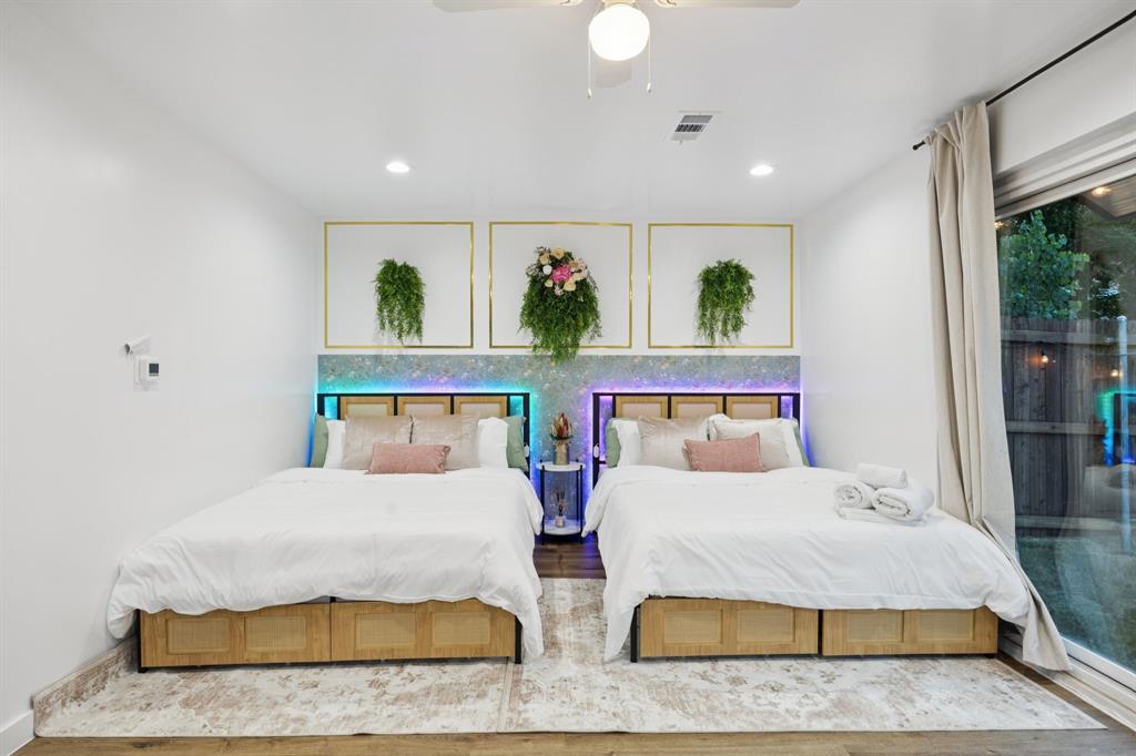 907 Bayonne Street Dallas, TX 75212 - Photo 24 of 38 a bedroom with double bed and a window