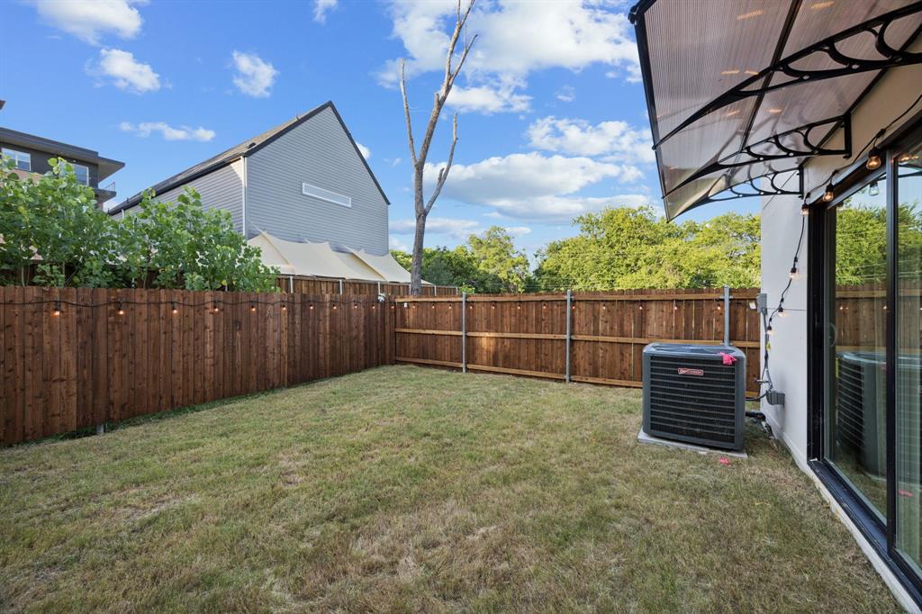 907 Bayonne Street Dallas, TX 75212 - Photo 34 of 38 a view of a backyard with wooden fence