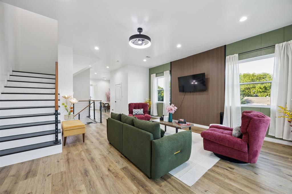 907 Bayonne Street Dallas, TX 75212 - Photo 8 of 38 a living room with furniture and a flat screen tv