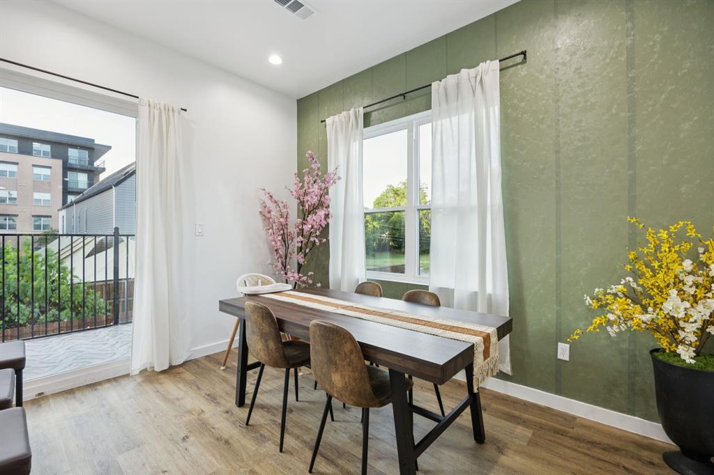 907 Bayonne Street Dallas, TX 75212 - Photo 10 of 38 a view of a dining room with furniture window and wooden floor