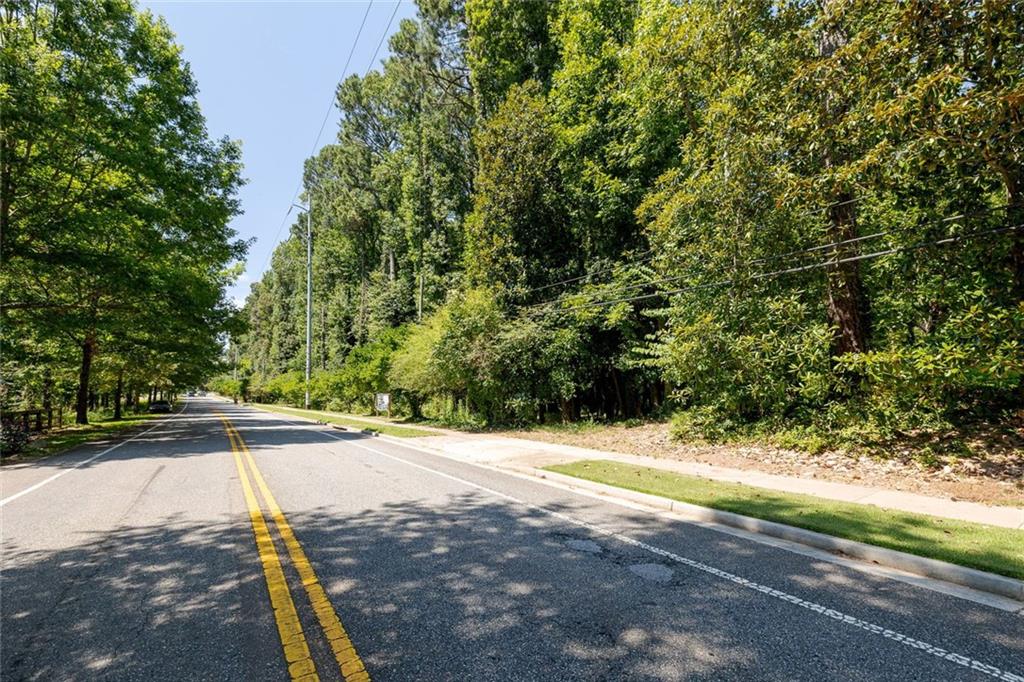657 Willeo Road Roswell, GA 30075 - Photo 3 of 18 a view of yard with large trees