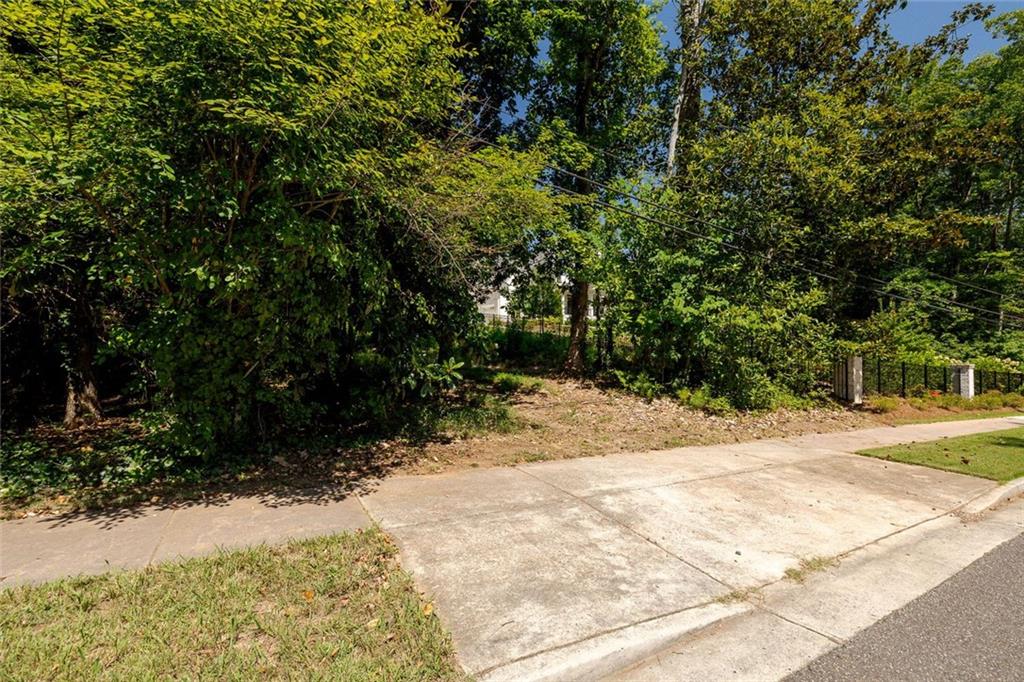 657 Willeo Road Roswell, GA 30075 - Photo 6 of 18 a view of a yard with plants and trees