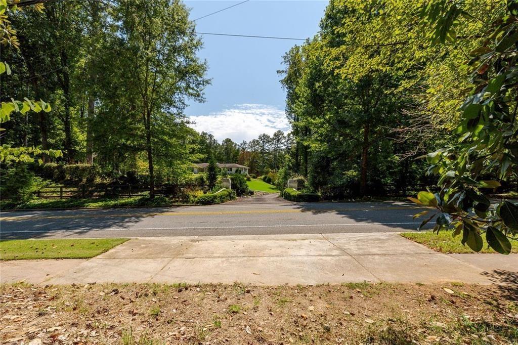 657 Willeo Road Roswell, GA 30075 - Photo 6 of 18 a view of a yard with plants and trees