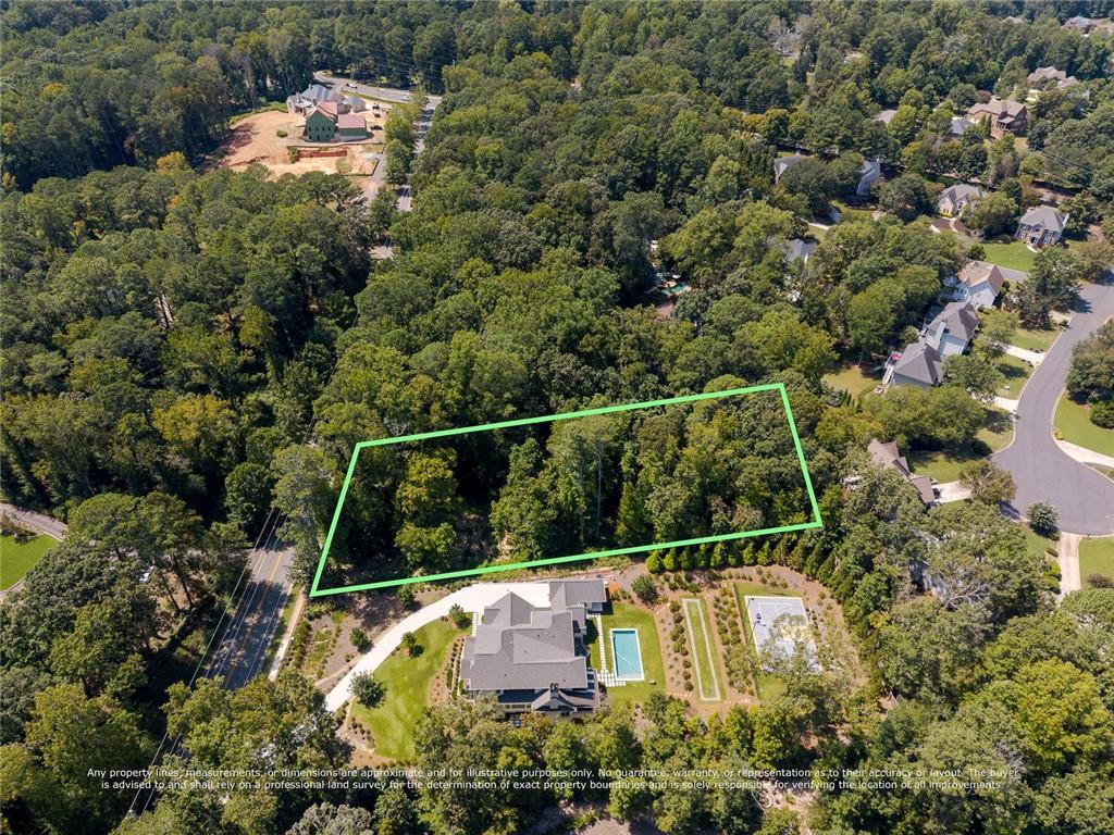 657 Willeo Road Roswell, GA 30075 - Photo 9 of 18 a view of a yard with a tree