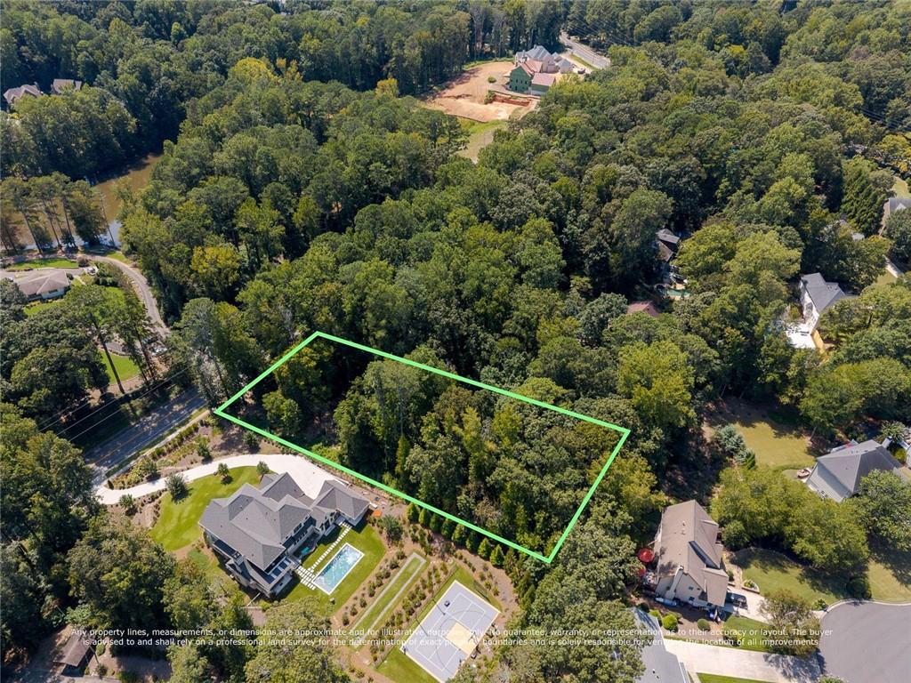 657 Willeo Road Roswell, GA 30075 - Photo 10 of 18 an aerial view of house with yard swimming pool and outdoor seating