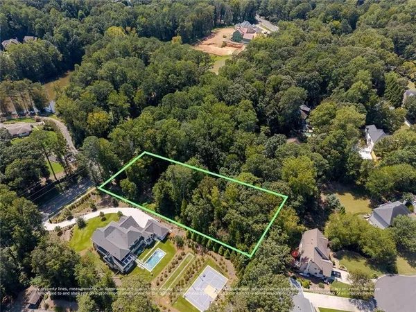 an aerial view of house with yard swimming pool and outdoor seating