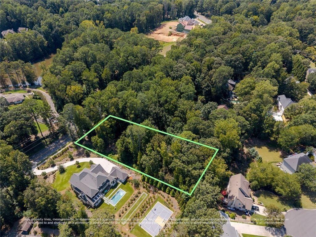 657 Willeo Road Roswell, GA 30075 - Photo 10 of 18 an aerial view of house with yard swimming pool and outdoor seating